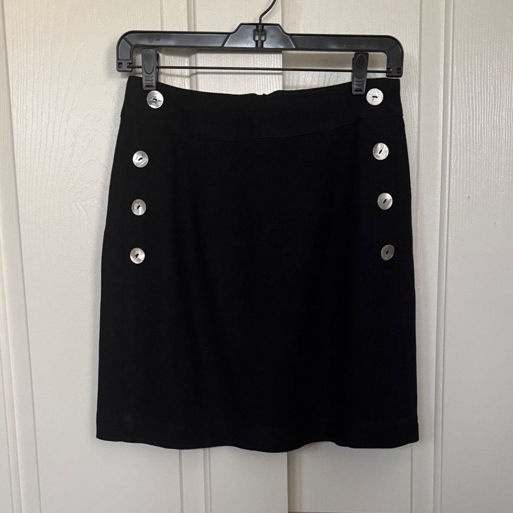 Express black A-line skirt, fully lined. With Button Accents. Back zipper.